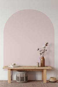 Boho Arch Wall Decal in pink behind a bench