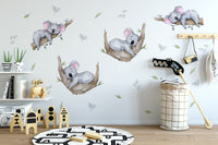Sleeping Koala Wall Decals beside a house-frame bed