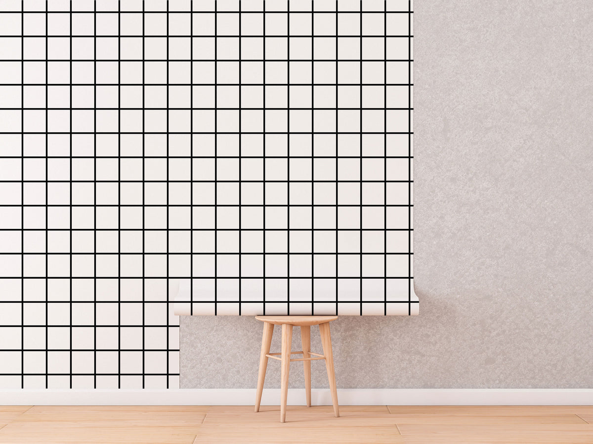 Black and White Grid Wallpaper roll shown against a wall