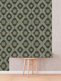 Vintage Green Medallion Wallpaper roll shown against a wall