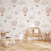 Pink Hot Air Balloon Wallpaper behind a rattan bench