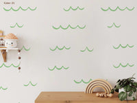 Ocean Wave Wall Decals in light green above a shelf