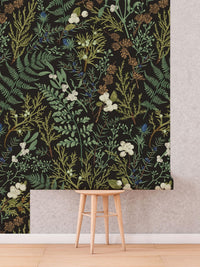 Vintage Fern Wallpaper roll shown against a wall