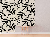 Abstract Leaves Wallpaper roll shown against a wall