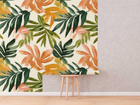Tropical Leaf Wallpaper roll shown against a wall