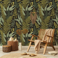 Dark Fern Botanical Wallpaper behind a rattan chair
