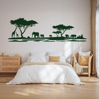 African Safari Silhouette Wall Decal in dark green above a bed