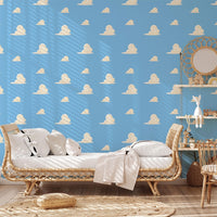 Blue Cloud Wallpaper behind a rattan daybed