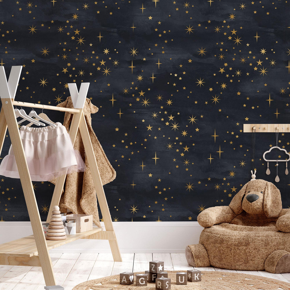 Celestial Starry Night Wallpaper behind a clothes rail