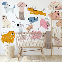 Children's room with colorful dog illustrations on the wall and a wicker crib.